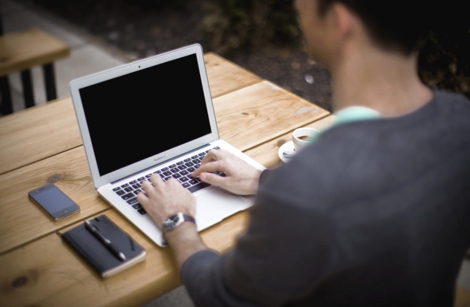 Financial documents and analysis tools spread across a desk
